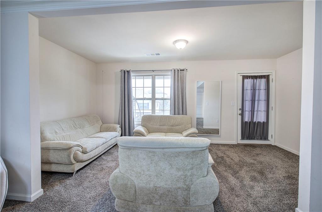 218 Orchard Trail Canton, GA 30115 - Photo 20 of 39 a living room with furniture and a window