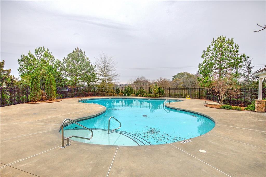 218 Orchard Trail Canton, GA 30115 - Photo 35 of 39 a view of a swimming pool with a yard and sitting area
