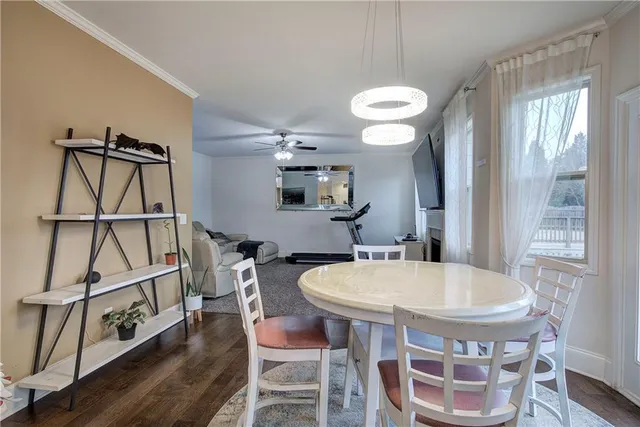 a view of a dining room with furniture window and wooden floor