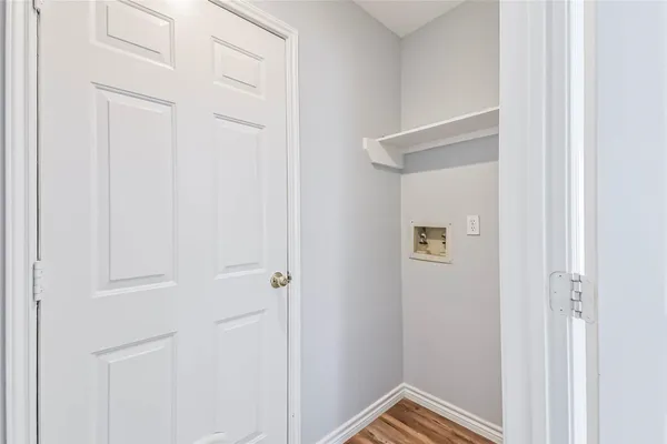 a view of main area fire place window and wooden floor