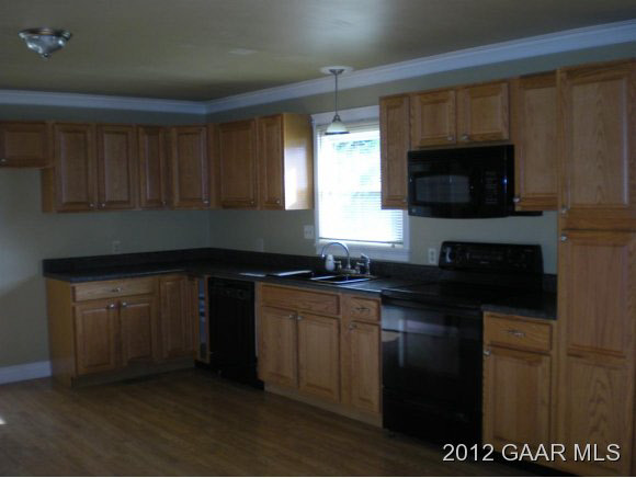 955 Ladd Road Waynesboro, VA 22980 - Photo 3 of 8 a kitchen with stainless steel appliances granite countertop a stove a sink and a microwave