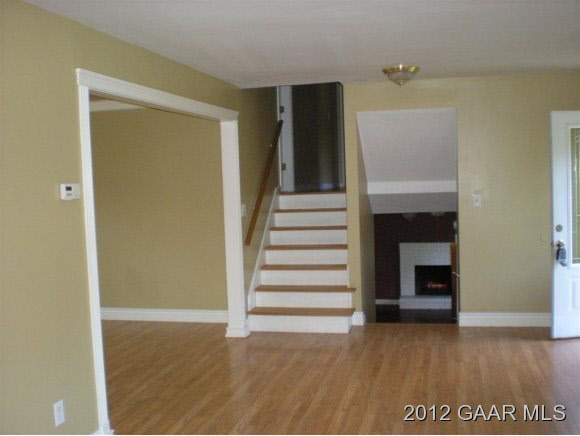 955 Ladd Road Waynesboro, VA 22980 - Photo 5 of 8 a view of a livingroom with wooden floor and staircase