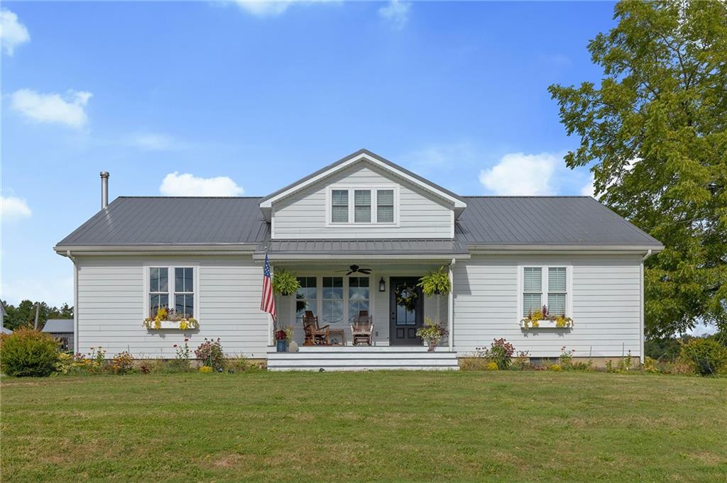 206 Lee Road Grove City, PA 16127 - Photo 43 of 44 a front view of a house with a garden
