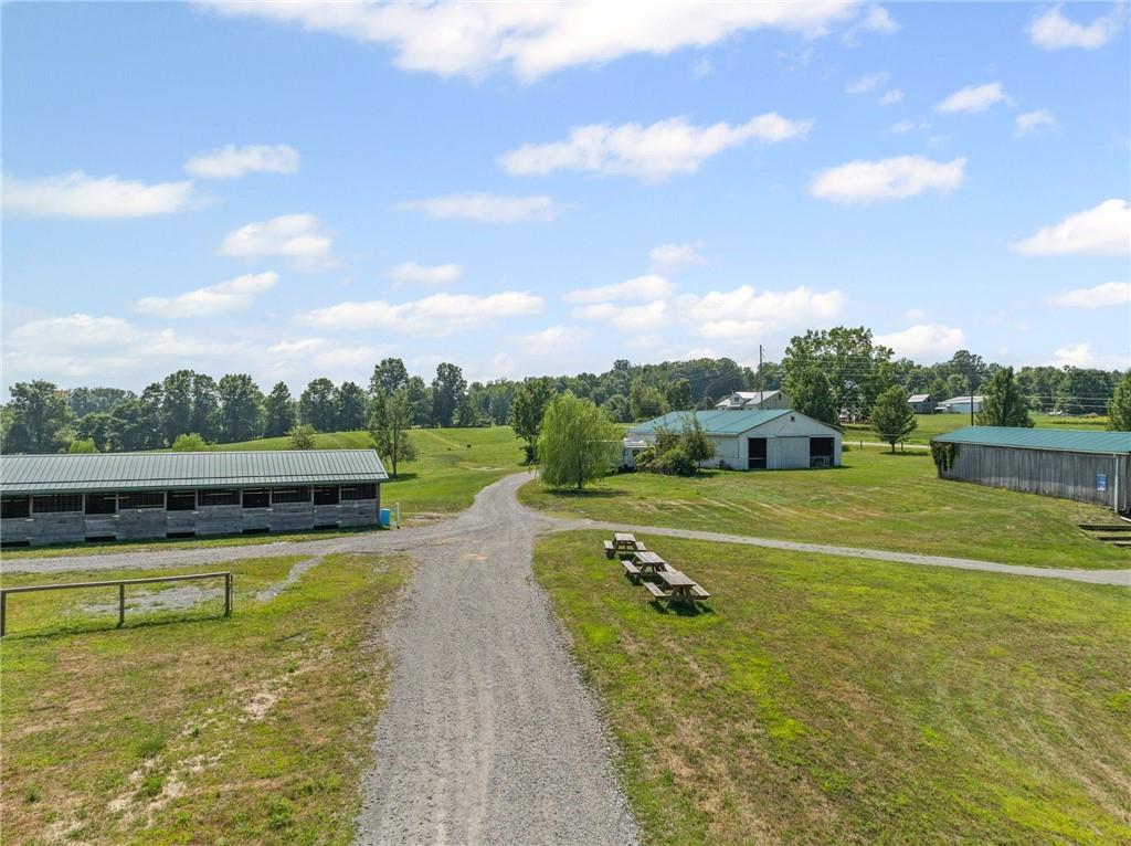 206 Lee Road Grove City, PA 16127 - Photo 5 of 44 a view of a lake with a big yard