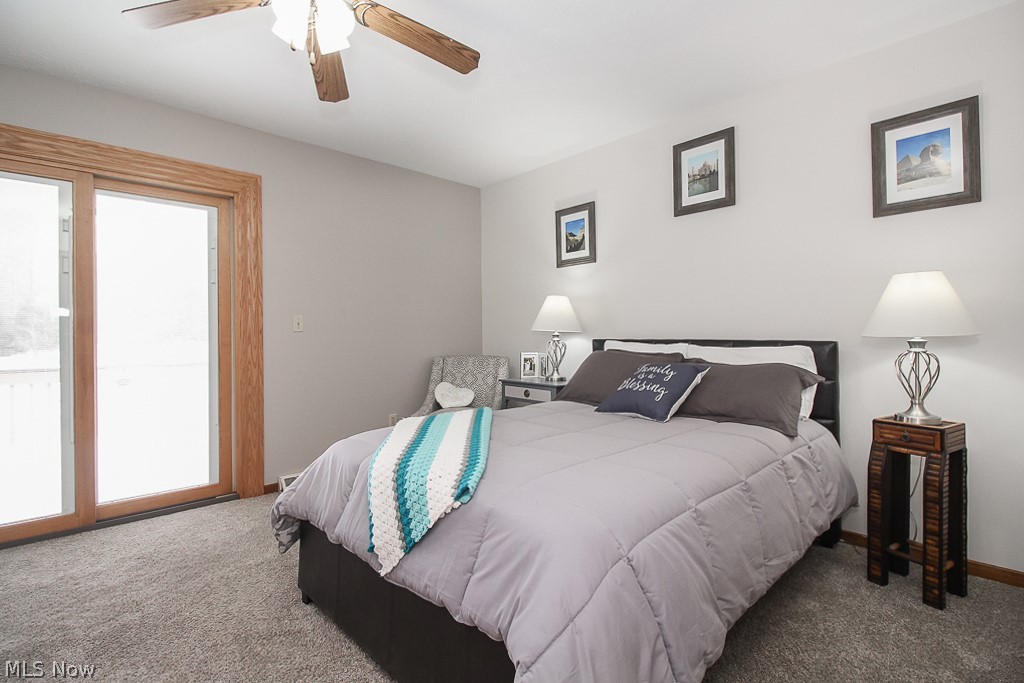 3025 State Road Medina, OH 44256 - Photo 14 of 34 Master bedroom - with new carpeting installed 12/2019. Large patio doors with built in blinds leads to a large patio that overlooks the pond.
