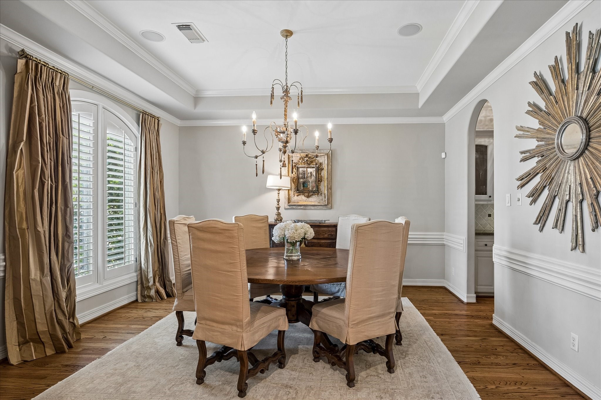 802 Anderson Street Bellaire, TX 77401 - Photo 6 of 36 The dining room is an excellent size with coffered ceilings, wood cased windows, plantation shutters, and beautiful hardwood flooring.