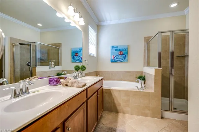 a bathroom with a granite countertop tub sink and mirror