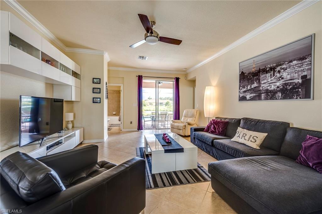 14796 Canton Court Naples, FL 34114 - Photo 2 of 22 a living room with furniture and a flat screen tv