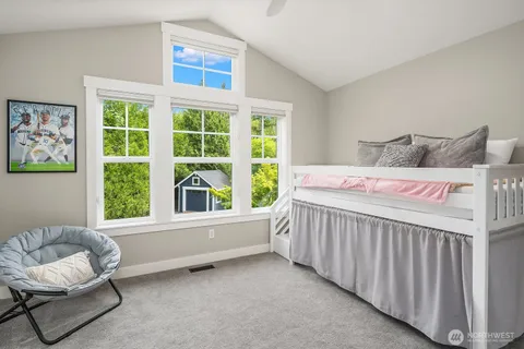 a bedroom with furniture and a window