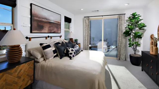 a bed room with a bed and a television