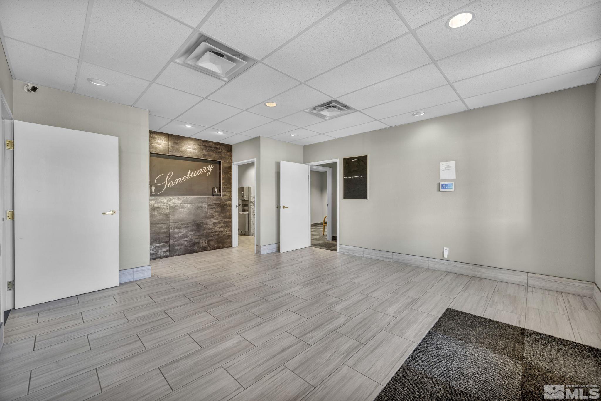 783 Basque Way Carson City, NV 89706 - Photo 12 of 39 a view of an empty room with wooden floor and a window