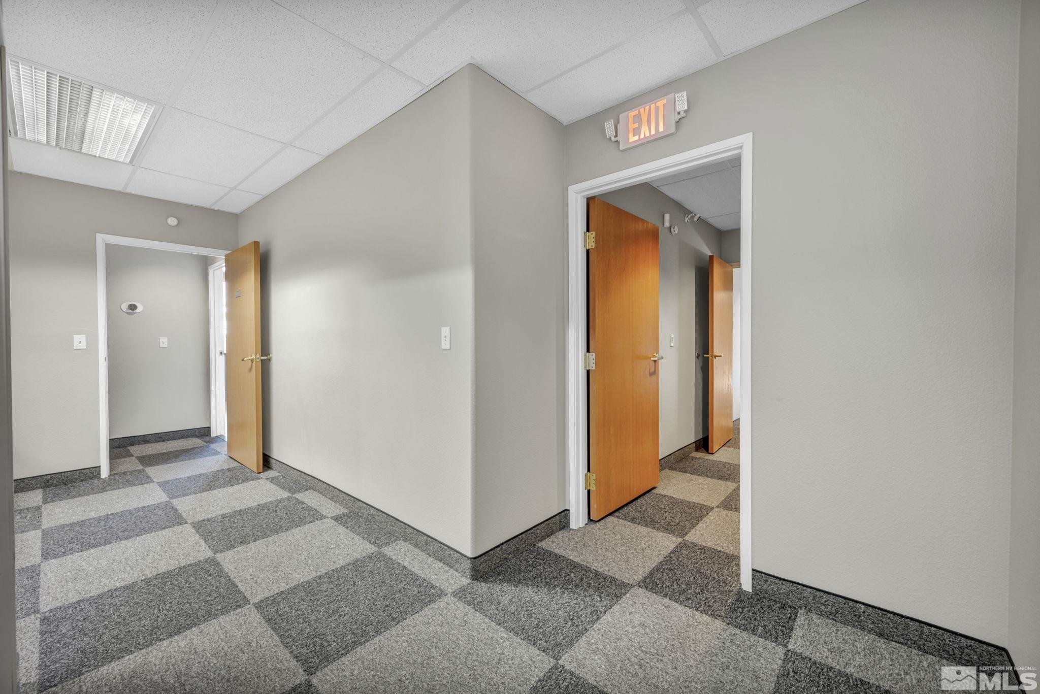 783 Basque Way Carson City, NV 89706 - Photo 15 of 39 a view of a hallway with wooden shelves