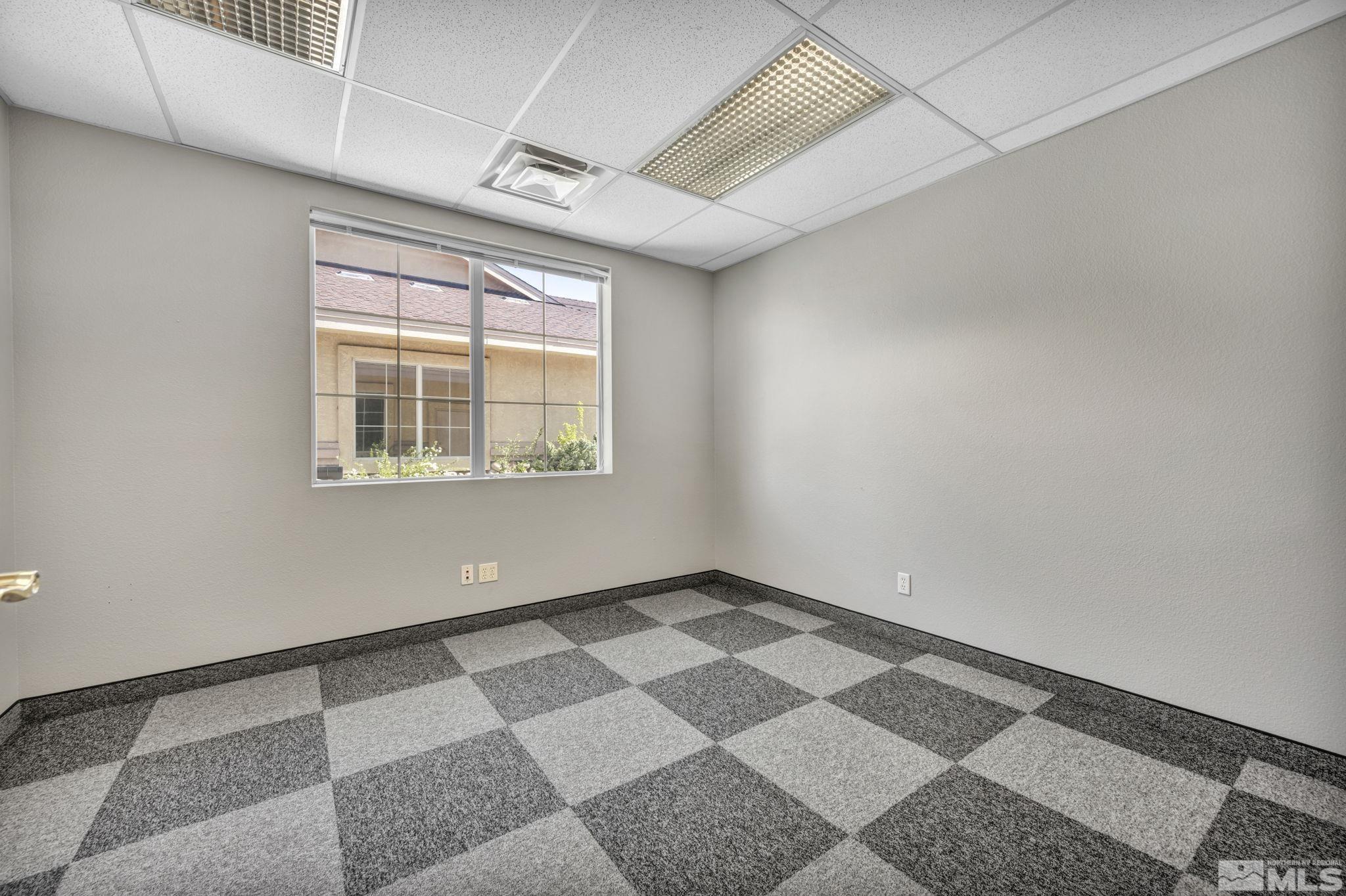 783 Basque Way Carson City, NV 89706 - Photo 22 of 39 a view of an empty room with a window