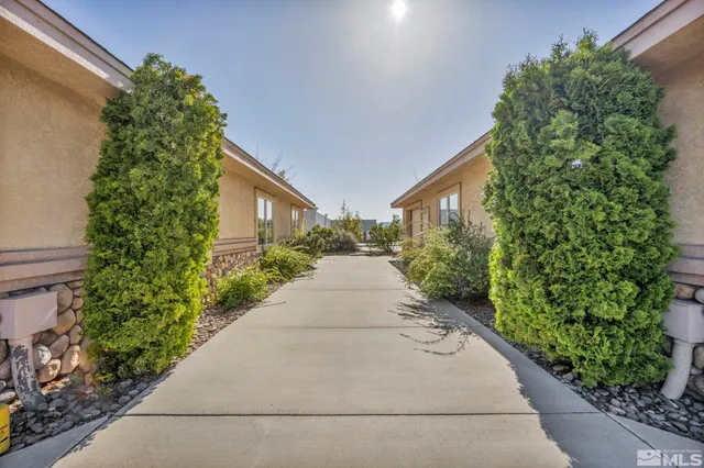 a view of path along with lots of green space
