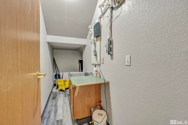 a bathroom with a sink a mirror and shower