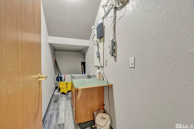 a bathroom with a sink a mirror and shower