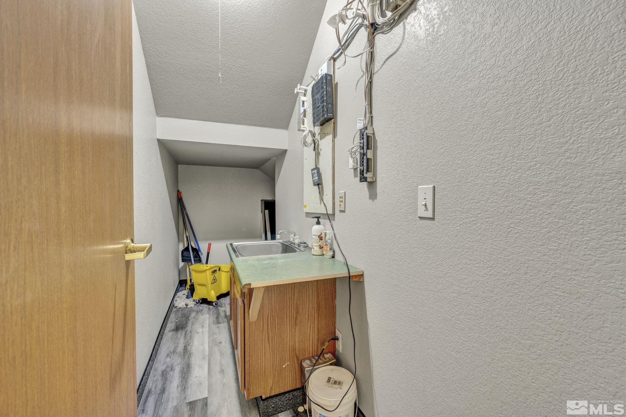 783 Basque Way Carson City, NV 89706 - Photo 34 of 39 a bathroom with a sink a mirror and shower