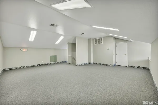 an empty room with a fireplace