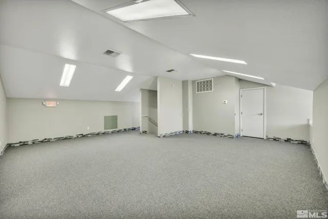 an empty room with a fireplace