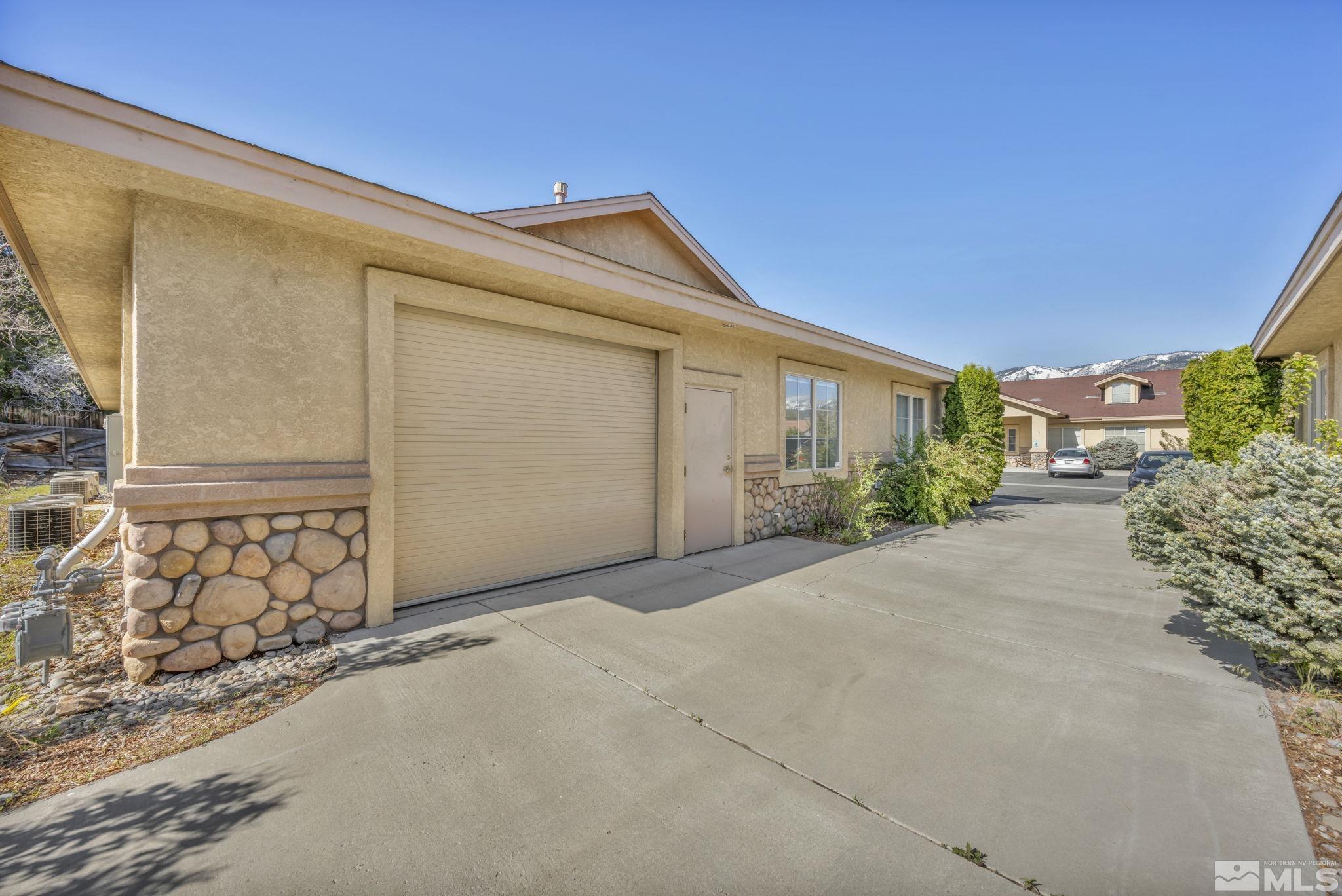 783 Basque Way Carson City, NV 89706 - Photo 5 of 39 a front view of a house with a yard
