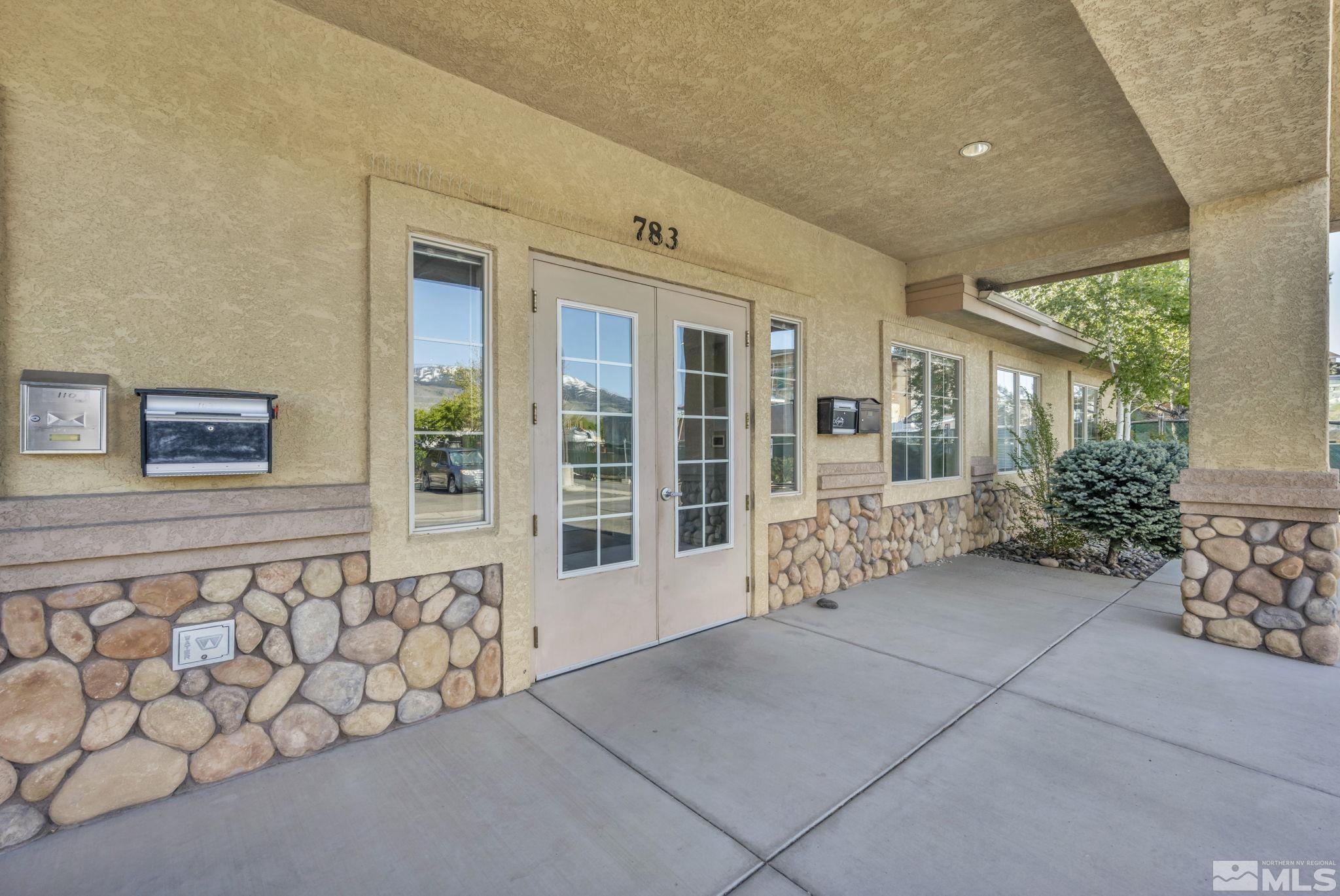 783 Basque Way Carson City, NV 89706 - Photo 8 of 39 front view of a house with a potted plant