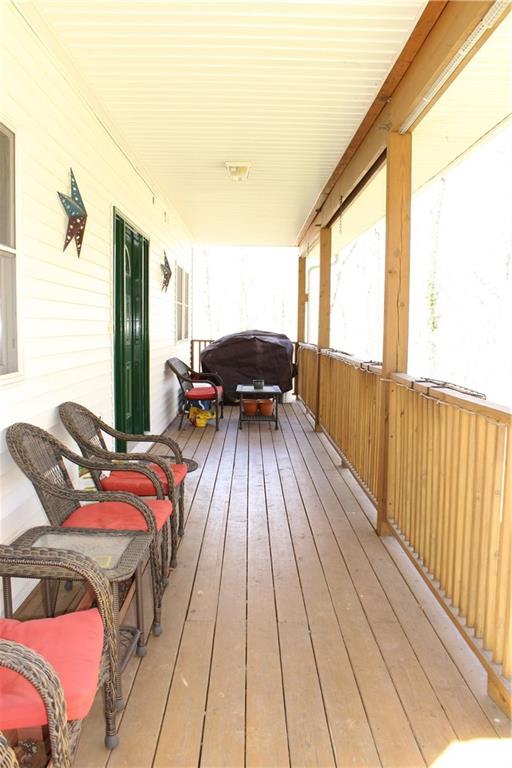 175 Ski-Slope Road Acme, PA 15610 - Photo 2 of 25 Full length front porch for enjoying a relaxing afternoon socializing with friends and family.