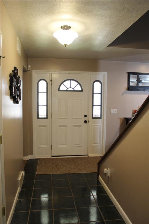 175 Ski-Slope Road Acme, PA 15610 - Photo 3 of 25 Large entry hall welcomes family and friends into your home.