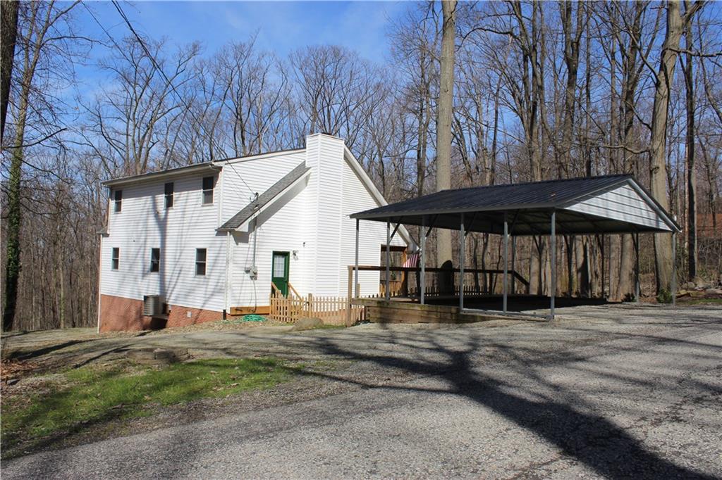 175 Ski-Slope Road Acme, PA 15610 - Photo 25 of 25 A great view of your home with the 2 year old carport and additional parking around back to your 3 car garage.