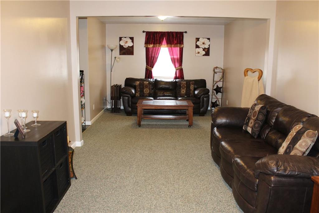 175 Ski-Slope Road Acme, PA 15610 - Photo 4 of 25 Living room with neutral paint and carpet makes it easy to adapt your own personal style into this great room.