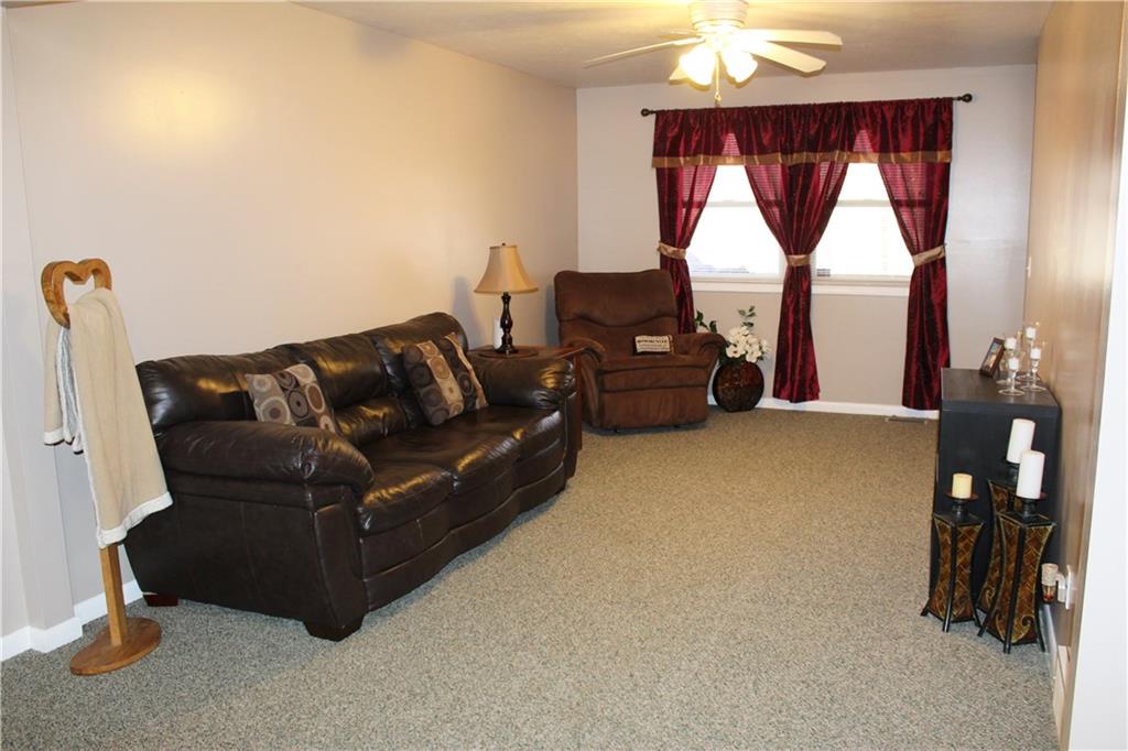 175 Ski-Slope Road Acme, PA 15610 - Photo 5 of 25 Bright windows allow natural sunlight to flow through the room.
