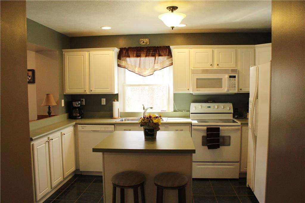 175 Ski-Slope Road Acme, PA 15610 - Photo 7 of 25 Generous counter space and island for meal prep.