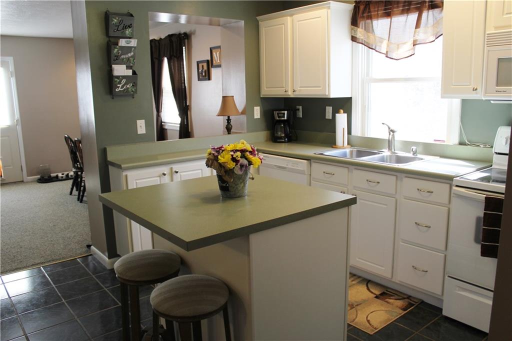 175 Ski-Slope Road Acme, PA 15610 - Photo 8 of 25 Fully equipped kitchen and opens to family and dining area.
