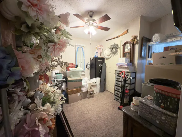 a very nice looking room with a large window and a fireplace