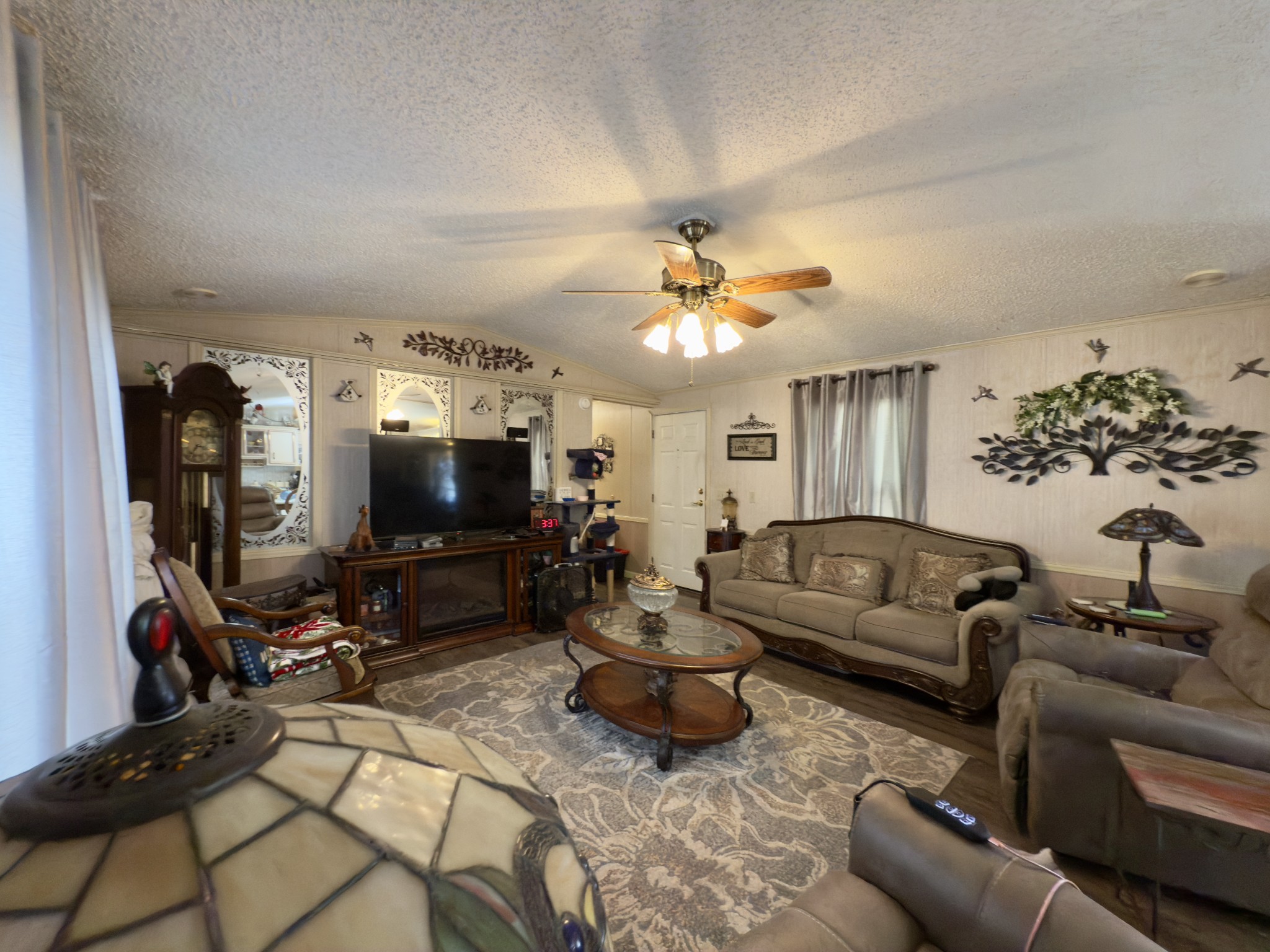 3794 Sulphur Creek Road Centerville, TN 37033 - Photo 3 of 21 a living room with furniture and a flat screen tv