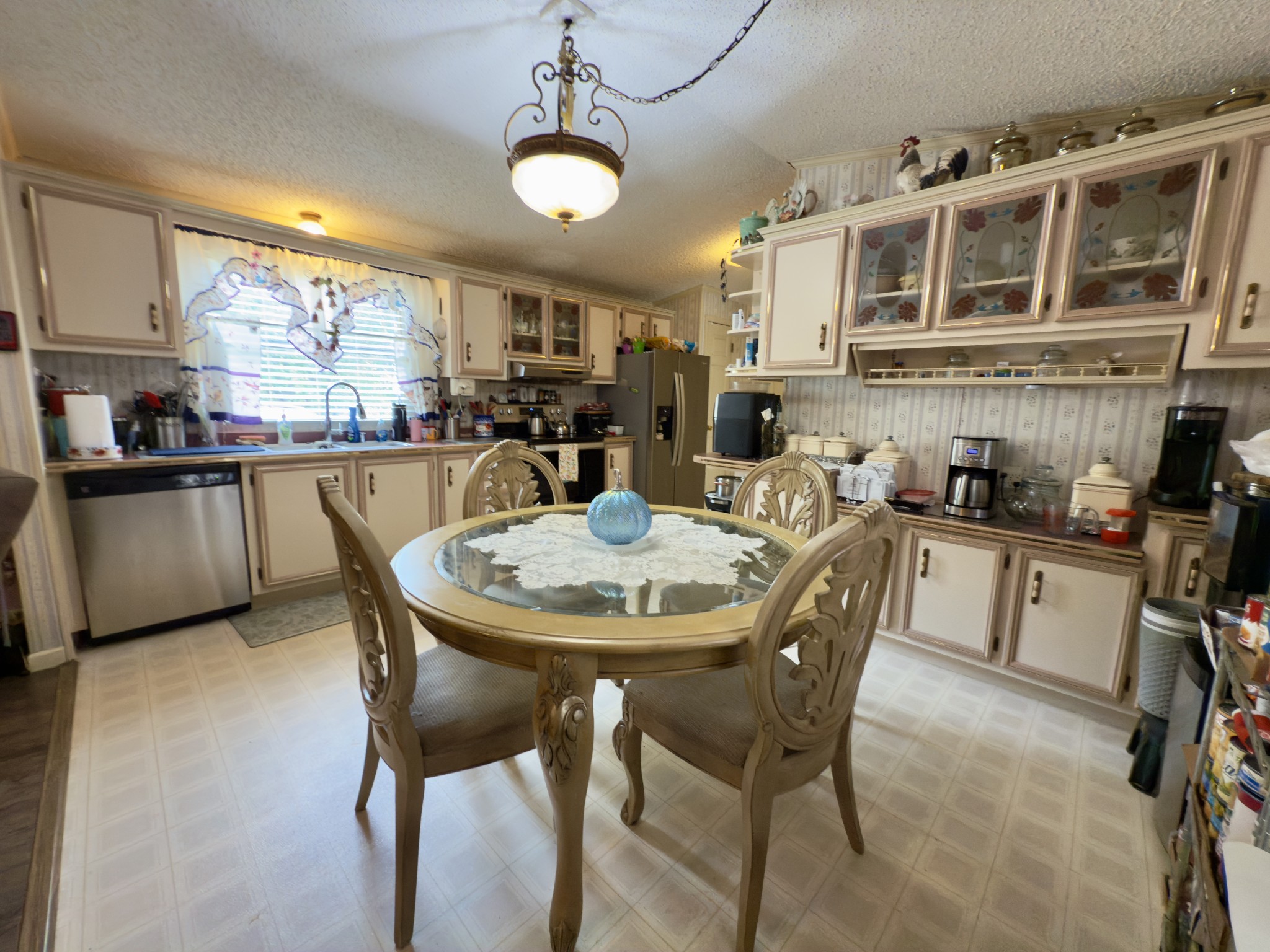 3794 Sulphur Creek Road Centerville, TN 37033 - Photo 8 of 21 a kitchen with a table chairs stove and cabinets