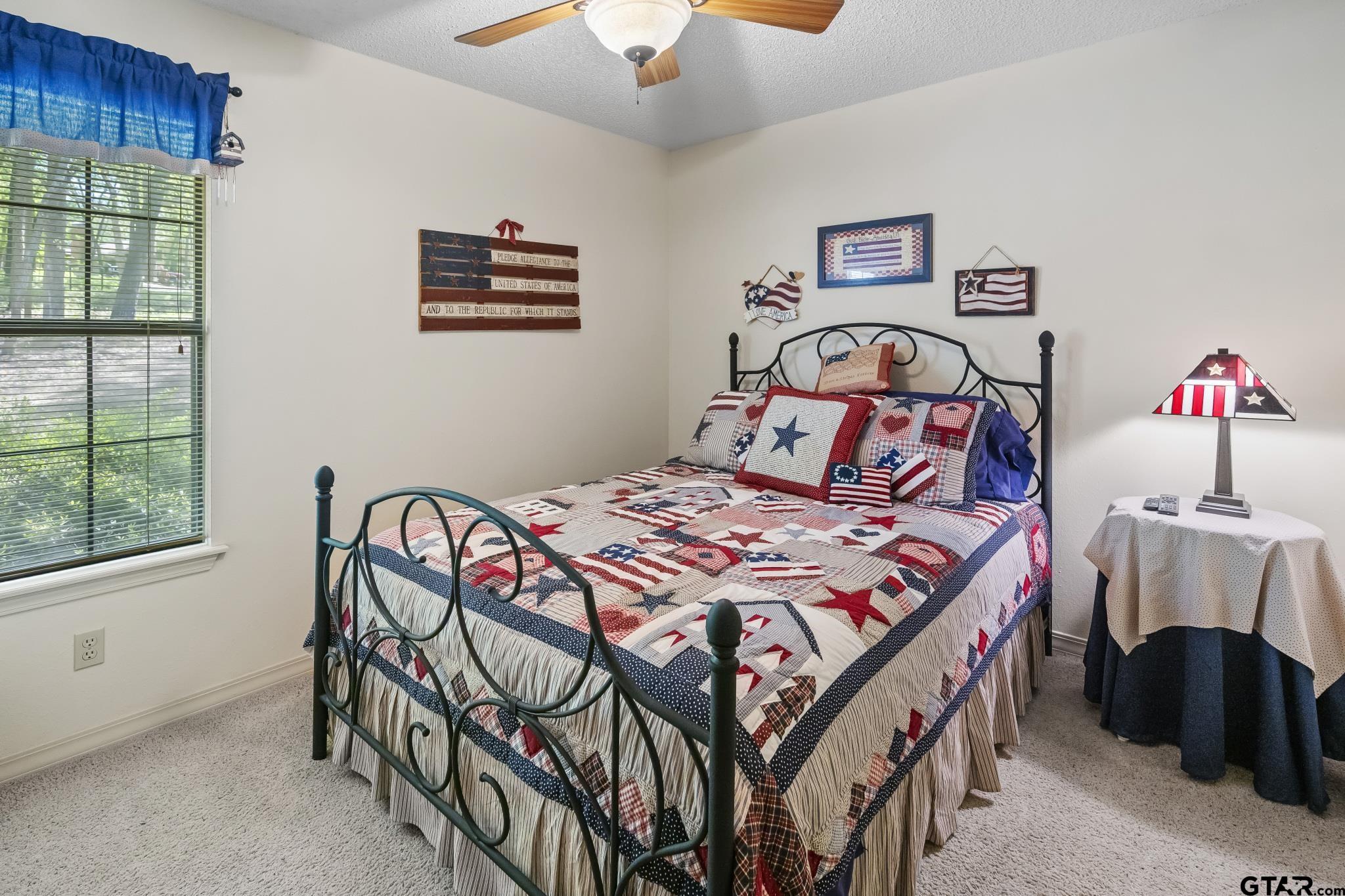 944 Clear Water Trail Holly Lake Ranch, TX 75765 - Photo 15 of 46 a bedroom with a bed and a window