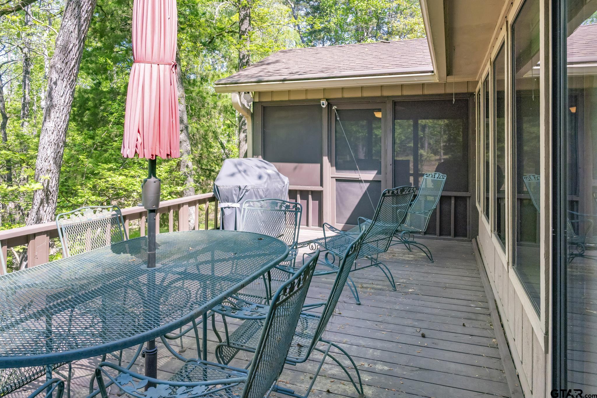 944 Clear Water Trail Holly Lake Ranch, TX 75765 - Photo 25 of 46 a view of a house with backyard and sitting area
