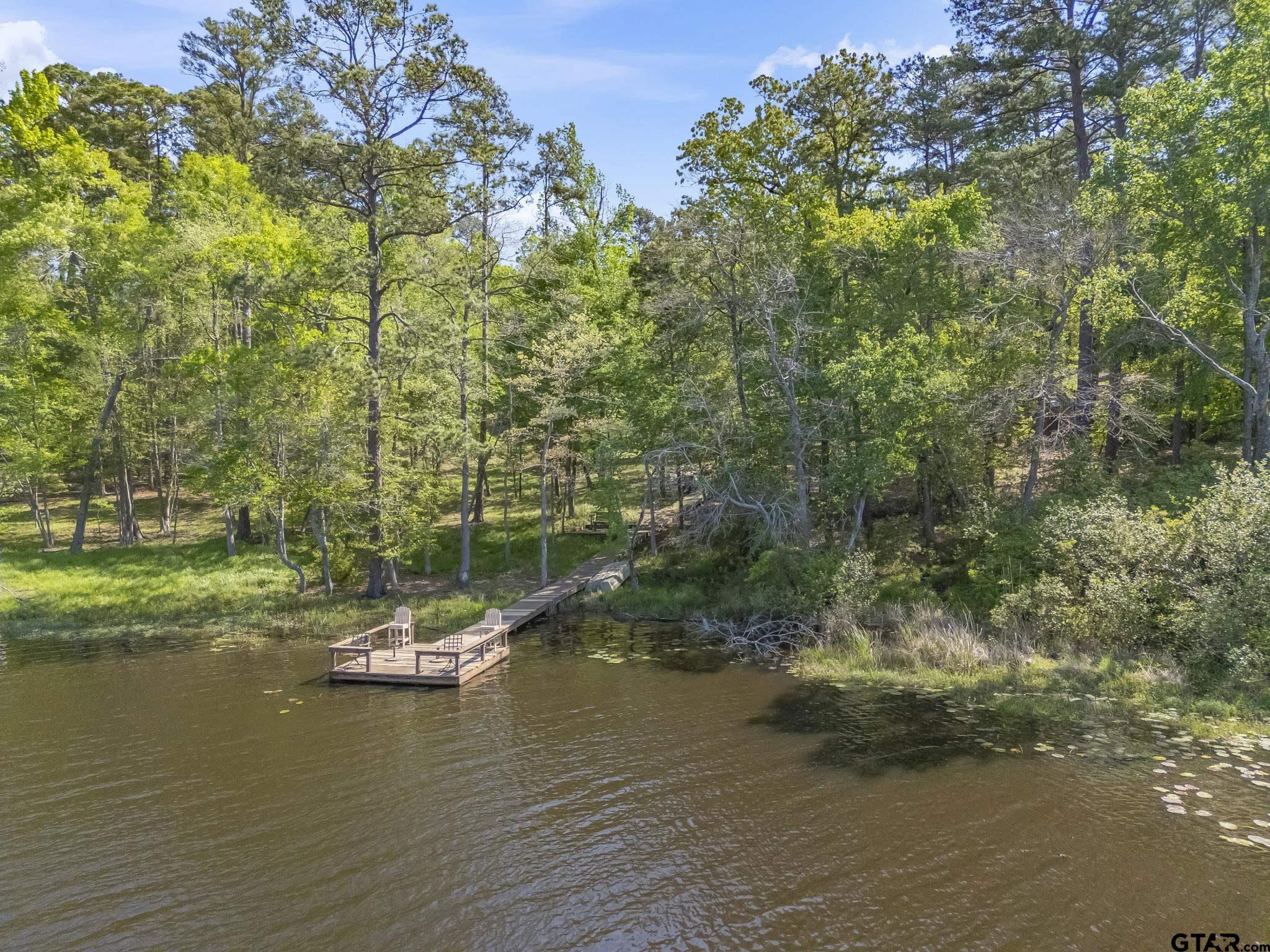 944 Clear Water Trail Holly Lake Ranch, TX 75765 - Photo 34 of 46 a view of a lake with houses