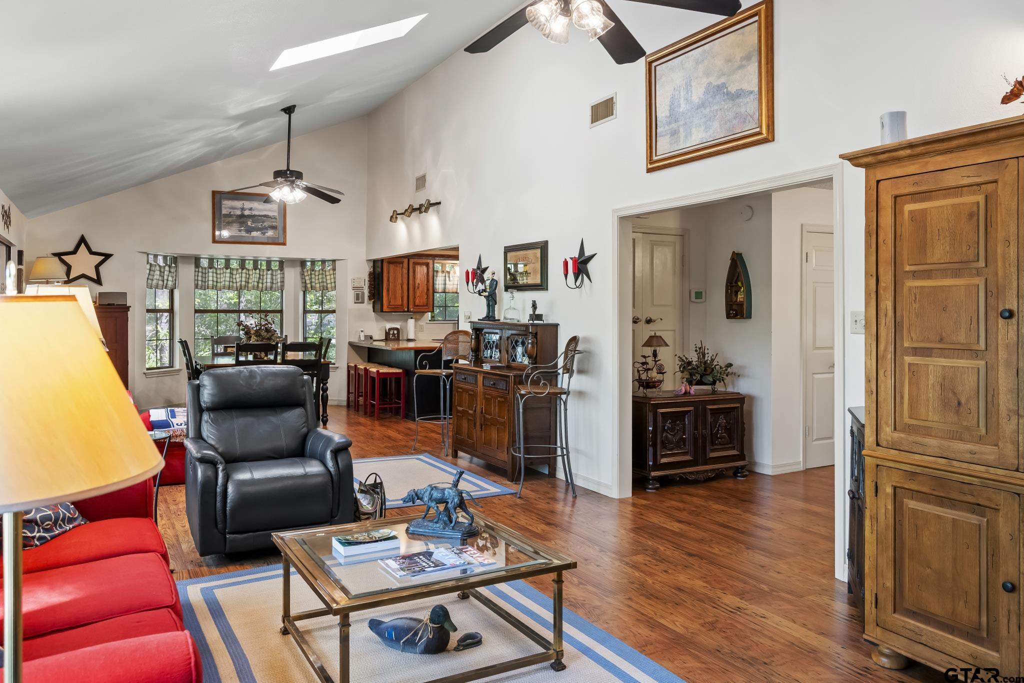 944 Clear Water Trail Holly Lake Ranch, TX 75765 - Photo 4 of 46 a living room with furniture and a flat screen tv