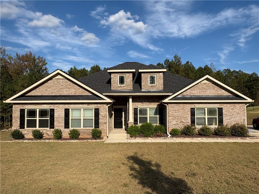 front view of a house with a yard