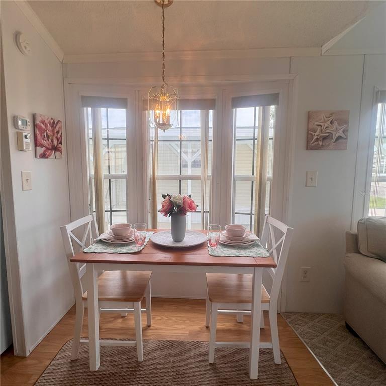 1202 Snook Punta Gorda, FL 33950 - Photo 12 of 34 a dining room with furniture and window