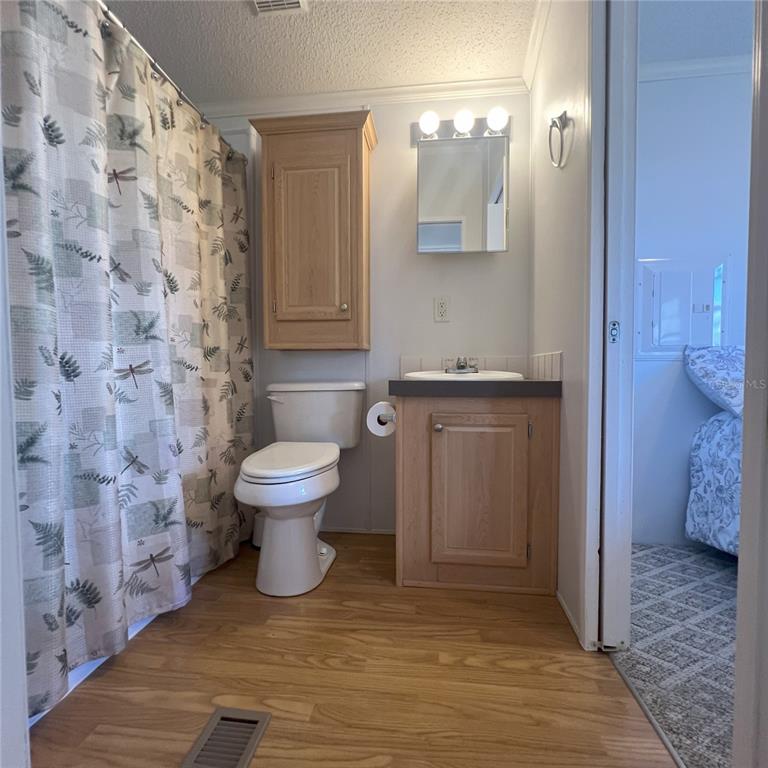 1202 Snook Punta Gorda, FL 33950 - Photo 14 of 33 a bathroom with a toilet and a shower