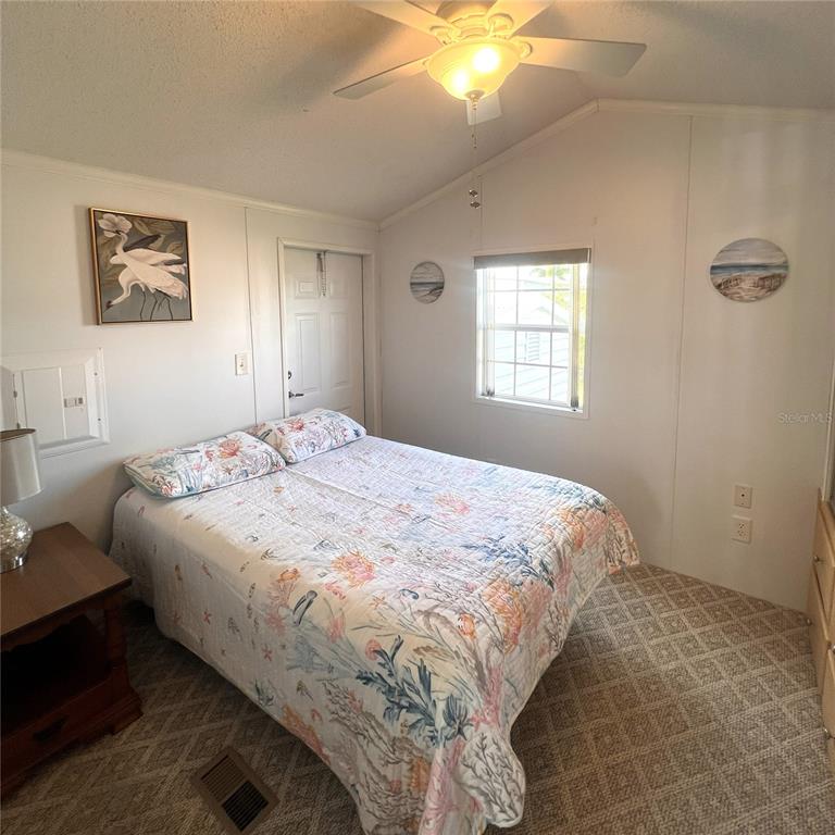 1202 Snook Punta Gorda, FL 33950 - Photo 14 of 34 a bedroom with a bed and a window