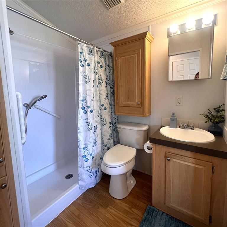 1202 Snook Punta Gorda, FL 33950 - Photo 19 of 34 a bathroom with a sink toilet and shower
