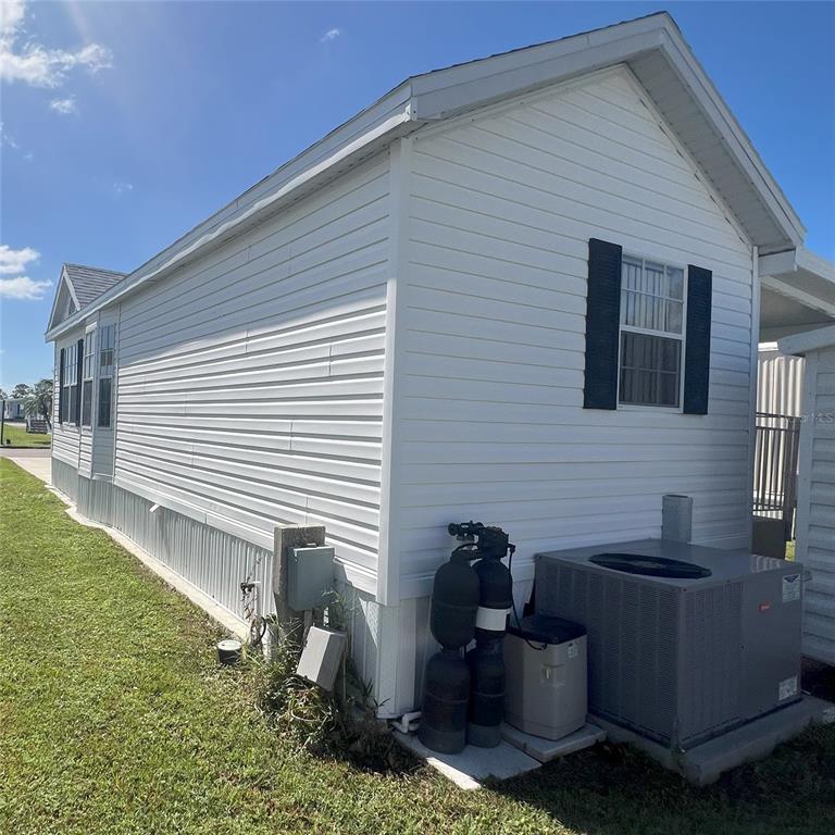 1202 Snook Punta Gorda, FL 33950 - Photo 21 of 33 a backyard of a house with seating space
