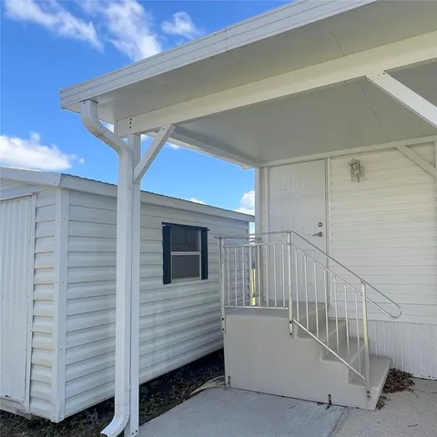 a view of a house with a roof deck
