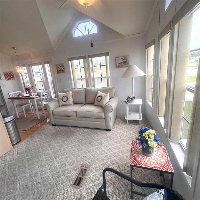 1202 Snook Punta Gorda, FL 33950 - Photo 5 of 34 a living room with furniture and a large window