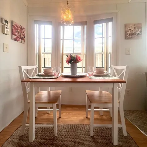 a dining room with furniture and window