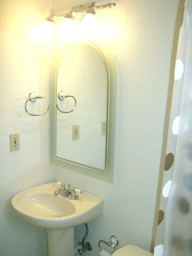 2301 Southwest 50th Terrace Plantation, FL 33317 - Photo 14 of 26 a bathroom with a sink mirror and toilet