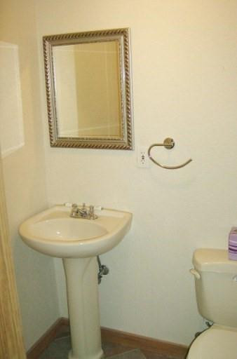 2301 Southwest 50th Terrace Plantation, FL 33317 - Photo 15 of 26 a bathroom with a toilet sink and mirror